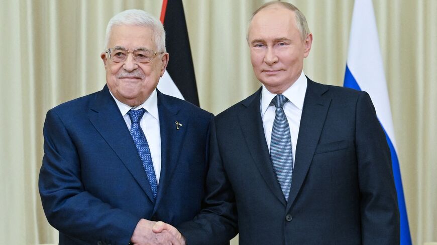 In this pool photograph distributed by Russian state owned Sputnik agency Russia's President Vladimir Putin (R) meets Palestinian Authority President Mahmud Abbas in Novo-Ogaryovo, outside Moscow on August 13, 2024. 